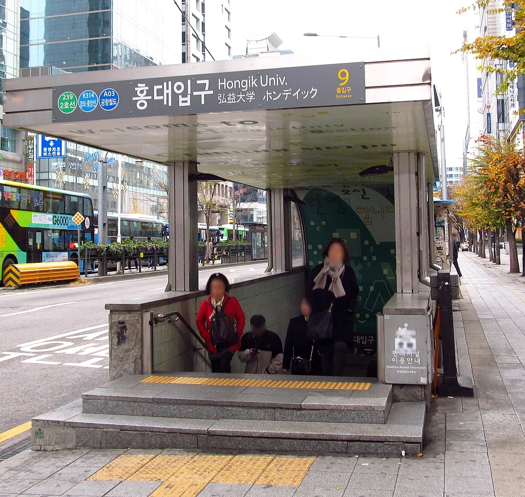 Hongik University Station entrance sign showing Seoul subway Exit 9